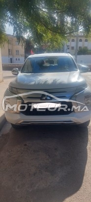 MITSUBISHI Pajero Voici un paragraphe version 4×4 : je vends une mitsubishi pajero sport 2020 blanche, 4×4 et boîte manuelle, en occasion